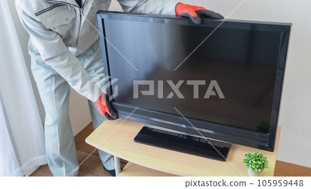 Image of workers installing TVs and TV delivery services Image of workers installing TVs and TV delivery services 105959448