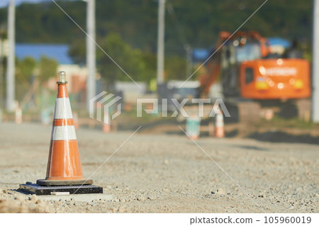 A triangular cone installed on the road at a road construction site 105960019