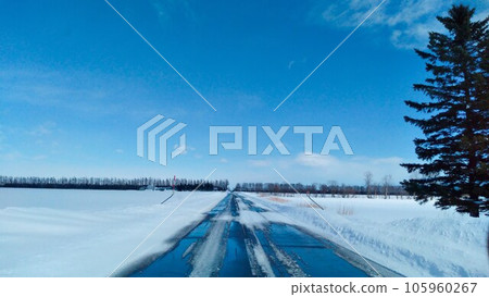 Straight road in Hokkaido in winter 105960267