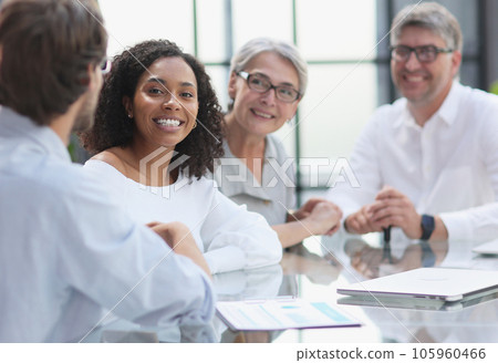discussion of successful business people in the office 105960466