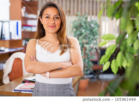 Portrait of friendly businesswoman in office Portrait of friendly businesswoman in office 105961449