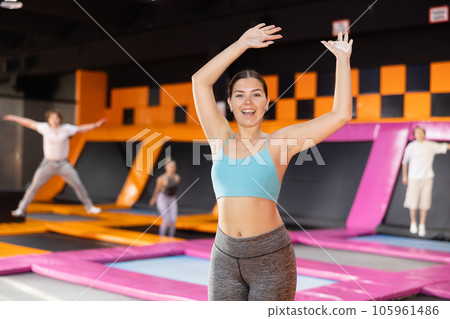 Young woman posing on workout in trampoline center 105961486