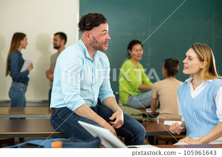 Man and woman students having conversation during recess 105961643