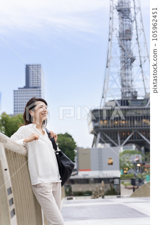 Arafif businesswoman woman on the central bridge looking at the city with the TV tower in the background Arafif businesswoman woman on the central bridge looking at the city with the TV tower in the background 105962451