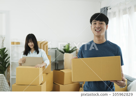Young married couple moving into new home. 105962829