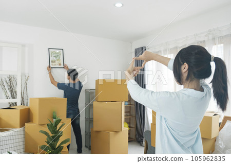 Young married couple moving into new home. Young married couple moving into new home. 105962835