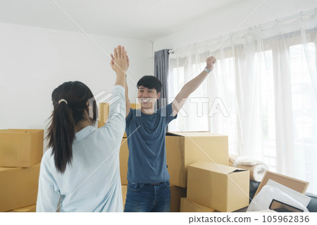 Young married couple moving into new home. 105962836