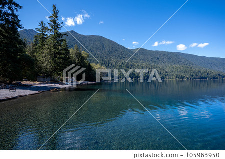 Tranquil summer afternoon on Lake Crescent in Olympic National Park, Washington. Tranquil summer afternoon on Lake Crescent in Olympic National Park, Washington. 105963950