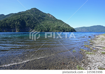 Tranquil summer afternoon on Lake Crescent in Olympic National Park, Washington. Tranquil summer afternoon on Lake Crescent in Olympic National Park, Washington. 105963996