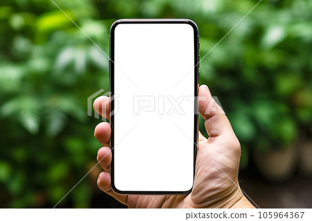 Hand using mobile smartphone in green forest background. smartphone with white empty display. 105964367