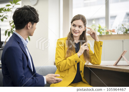 Global business image Two business people talking with a smile Global business image Two business people talking with a smile 105964467