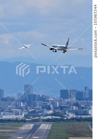 Bird's-eye view of Osaka Airport Reverse run 14R Airplanes taking off and landing 105965544