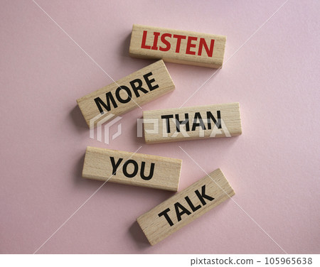 Listening skills symbol. Concept words Listen more than you Talk on wooden blocks. Beautiful pink background. Business and Listen more than you Talk concept. Copy space 105965638