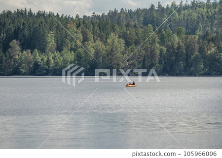 couple Kayaking Boat tour on lake Ragnerudssjoen in Dalsland Sweden beautiful nature forest pinetree 105966006
