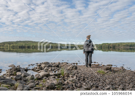 Girl standing at Lake Ragnerudssjoen mirror in Dalsland Sweden beautiful nature forest pinetree swedish Girl standing at Lake Ragnerudssjoen mirror in Dalsland Sweden beautiful nature forest pinetree swedish 105966034