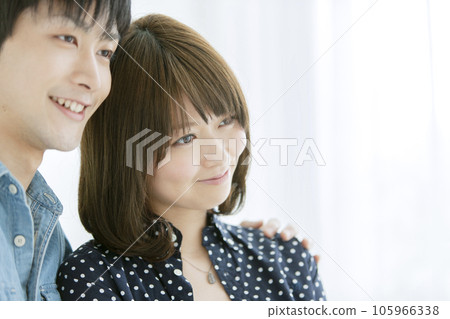 A couple of cuddling smiles A couple of cuddling smiles 105966338