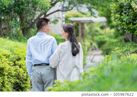 Senior couple walking in the park Senior couple walking in the park 105967622