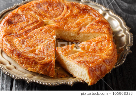 Kouign amann traditional french sweet cake closeup on the plate. Horizontal 105968353