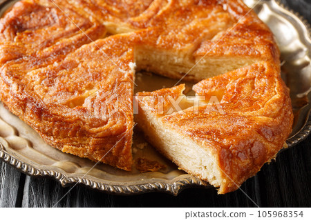 Kouign amann French pastries of Brittany region closeup on the plate. Horizontal 105968354