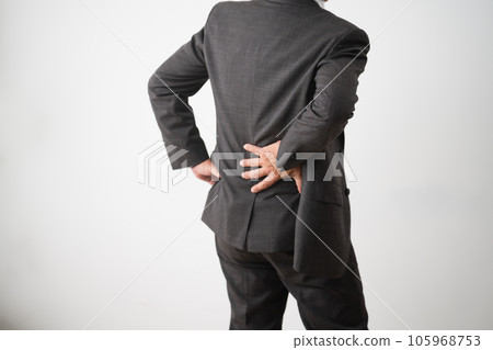 Middle-aged man with back pain business image 105968753