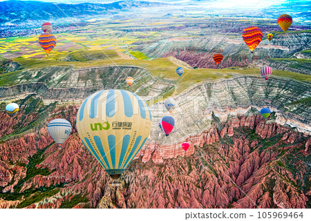 Cappadocia, Turkiye - July 07, 2023-Air balloons in Cappadocia-unreal views in valley. 105969464