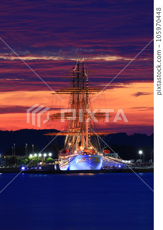 Sunset sky landscape with sailing ship 105970448