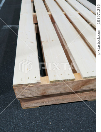 Landscape with wooden pallets in distribution warehouse 105971256
