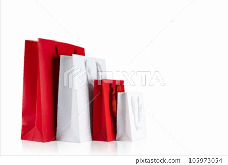 Various sizes of holiday shopping gift bags on isolated white background. Various sizes of holiday shopping gift bags on isolated white background. 105973054