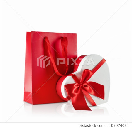 Various sizes of holiday shopping gift bags on isolated white background. Various sizes of holiday shopping gift bags on isolated white background. 105974081
