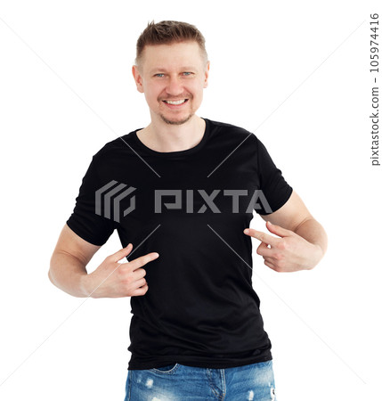 Man in a black T-shirt isolaled on a white background, finger point. Blank for your design 105974416