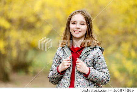 Portrait of beautiful little girl in autumn park Portrait of beautiful little girl in autumn park 105974899