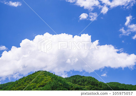 Large pure white clouds and fresh green mountains Kiso 105975057