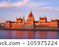 A view of the Hungarian Parliament Building in the setting sun from across the Danube (long exposure) 105975224