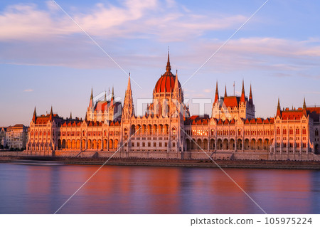 A view of the Hungarian Parliament Building in the setting sun from across the Danube (long exposure) 105975224