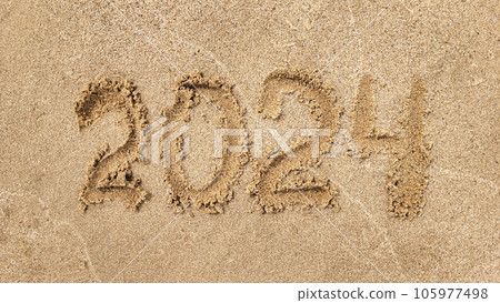 The numbers 2024 are written on the sandy beach. The concept of the new year The numbers 2024 are written on the sandy beach. The concept of the new year 105977498