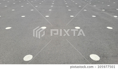 Grey asphalt with round white marking points on the playground. Grey asphalt with round white marking points on the playground. 105977501