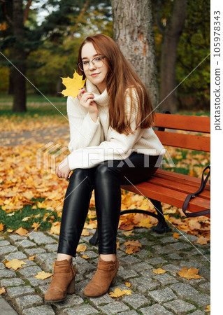 Fall Mental Wellness. Seasonal Mindful Balance. Autumn Emotional Harmony. Portrait of beautiful redhead calm serene woman fall autumn nature background. Fall Mental Wellness. Seasonal Mindful Balance. Autumn Emotional Harmony. Portrait of beautiful redhead calm serene woman fall autumn nature background. 105978343