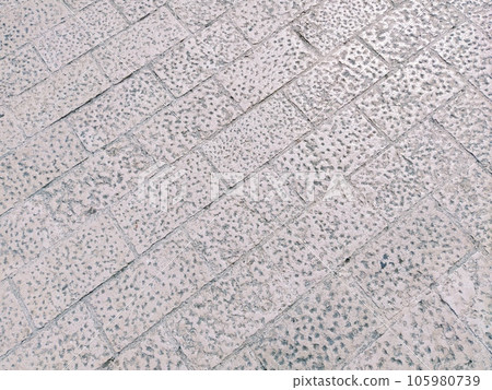 Marble floor on the street, Dubrovnik, Croatia. Antique masonry tiles from rectangular blocks. Black and white photo. Marble is a metamorphic rock composed of calcite CaCO3 mixed with other minerals 105980739