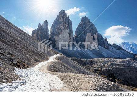 Tourists on the trail on Three Peaks of Lavaredo on autumn time Tourists on the trail on Three Peaks of Lavaredo on autumn time 105981350