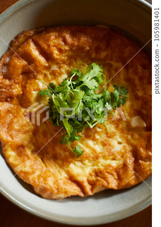 Traditional Thai omelette with coriander Traditional Thai omelette with coriander 105981401