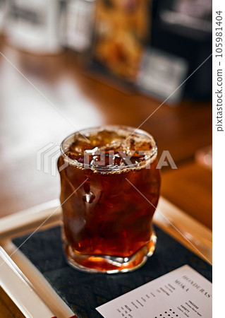 iced black coffee or americano on the wooden table iced black coffee or americano on the wooden table 105981404