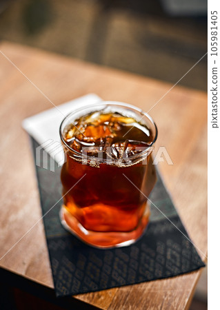 iced black coffee or americano on the wooden table iced black coffee or americano on the wooden table 105981405