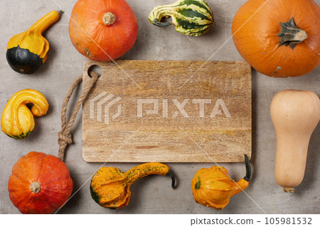 autumn flat lay on concrete background with cutting board 105981532