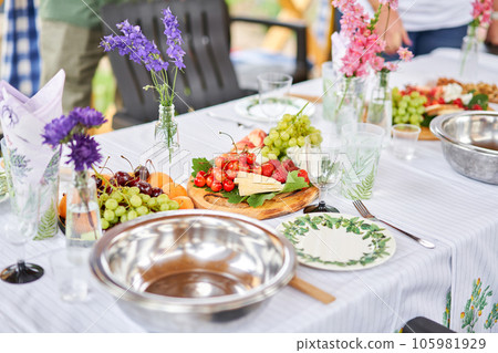 Master class and cheese tasting. Women make cheese. The enzyme and starter culture are added to the milk in a metal container. Milk folding process, home production, business, entrepreneur. 105981929