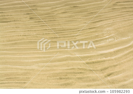Waves of sand on one of Pacific ocean beaches Waves of sand on one of Pacific ocean beaches 105982293