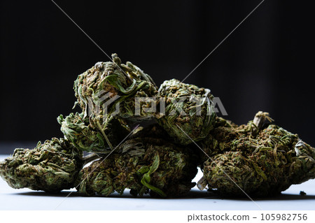 Marijuana buds on dark background, close up Marijuana buds on dark background, close up 105982756