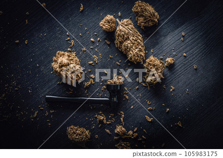 Dry CBD cannabis with metal smoking pipe 105983175
