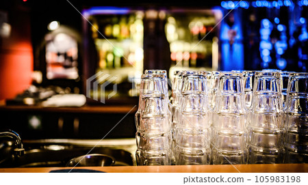 Stylish night bar counter with glasses Stylish night bar counter with glasses 105983198