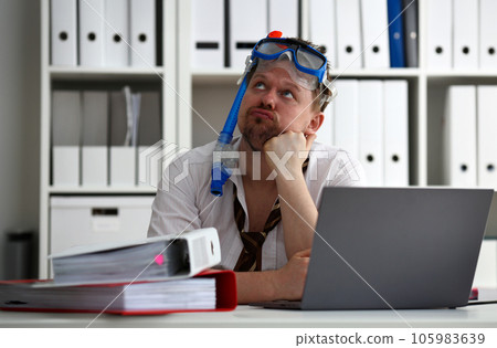 Man wearing suit and tie in goggles with snorkel Man wearing suit and tie in goggles with snorkel 105983639