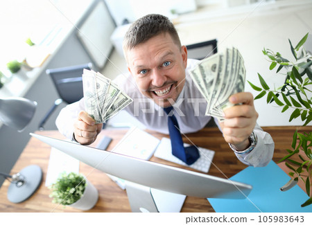 Handsome smiling adult caucasian businessman hold 105983643
